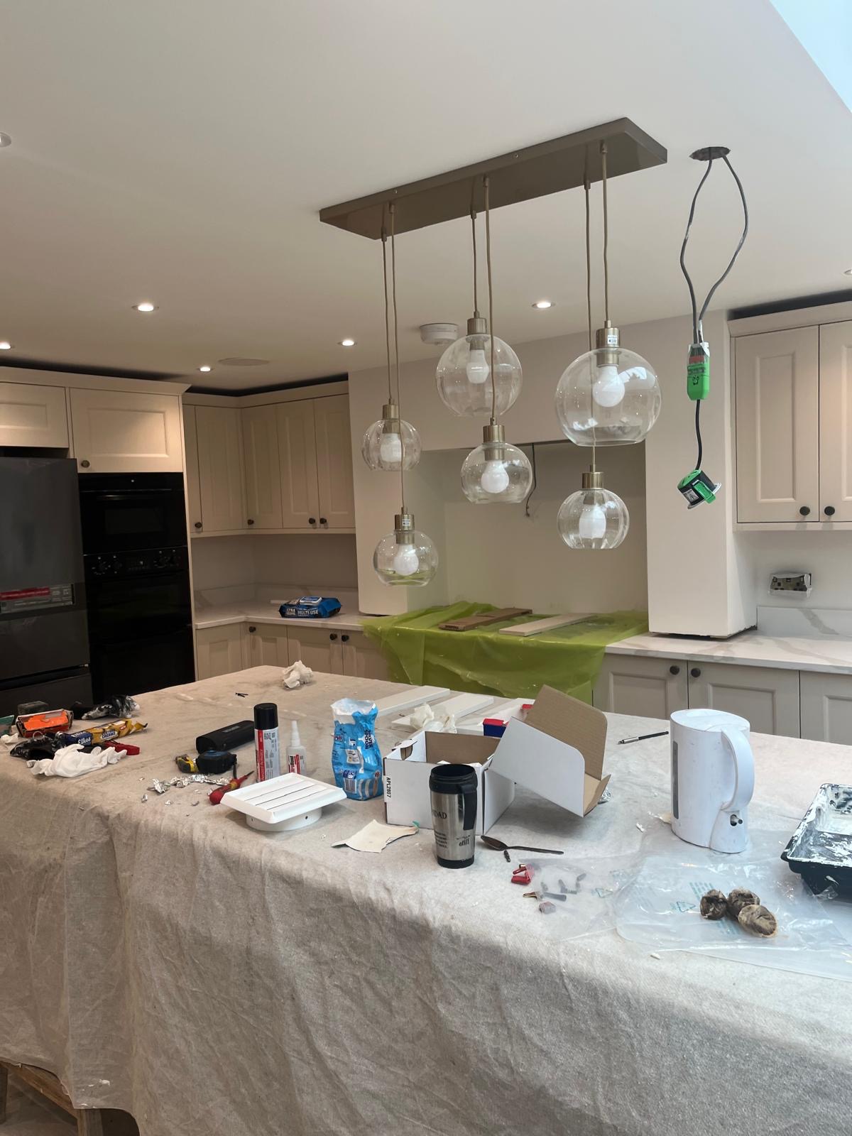 Installed statement chandelier above a kitchen island